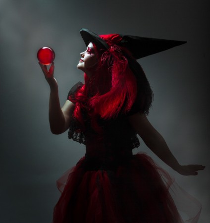 Amy dressed in her Red Witch outfit with red ball