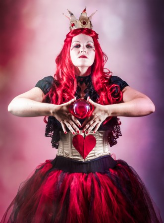 The Queen of Hearts Amy in her Red Queen outfit with her red ball.