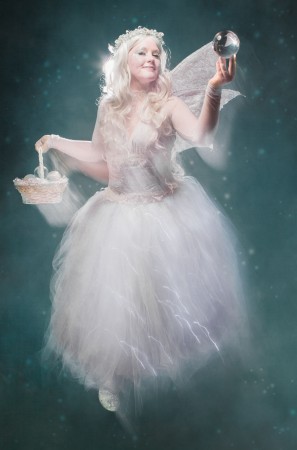 Amy in her Winter Fairy outfit with a basket of crystal balls. 